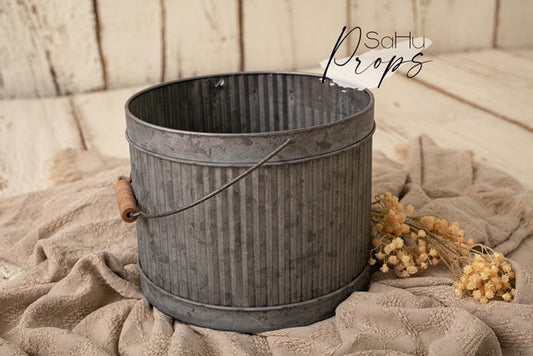 ribbed metal bucket with wooden handle