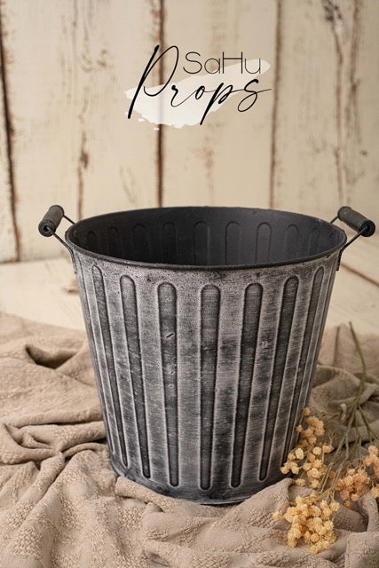 Gray metal bucket
